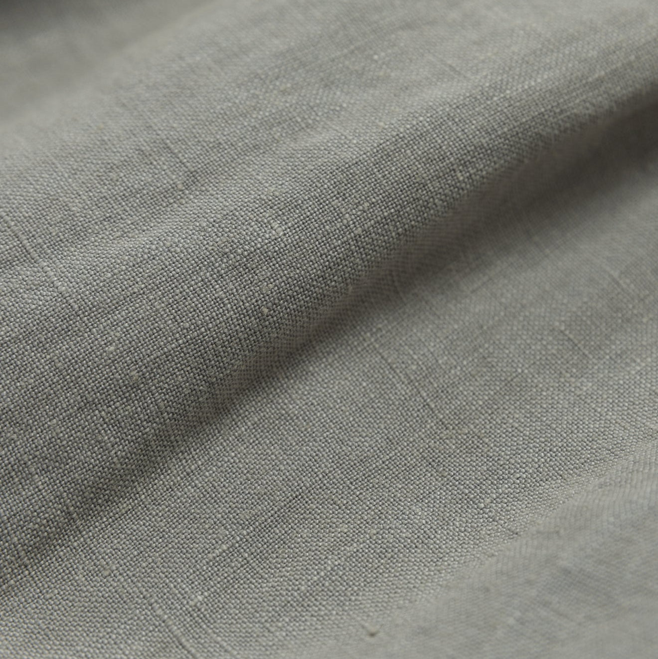 Close-up of gray fabric with a subtle texture