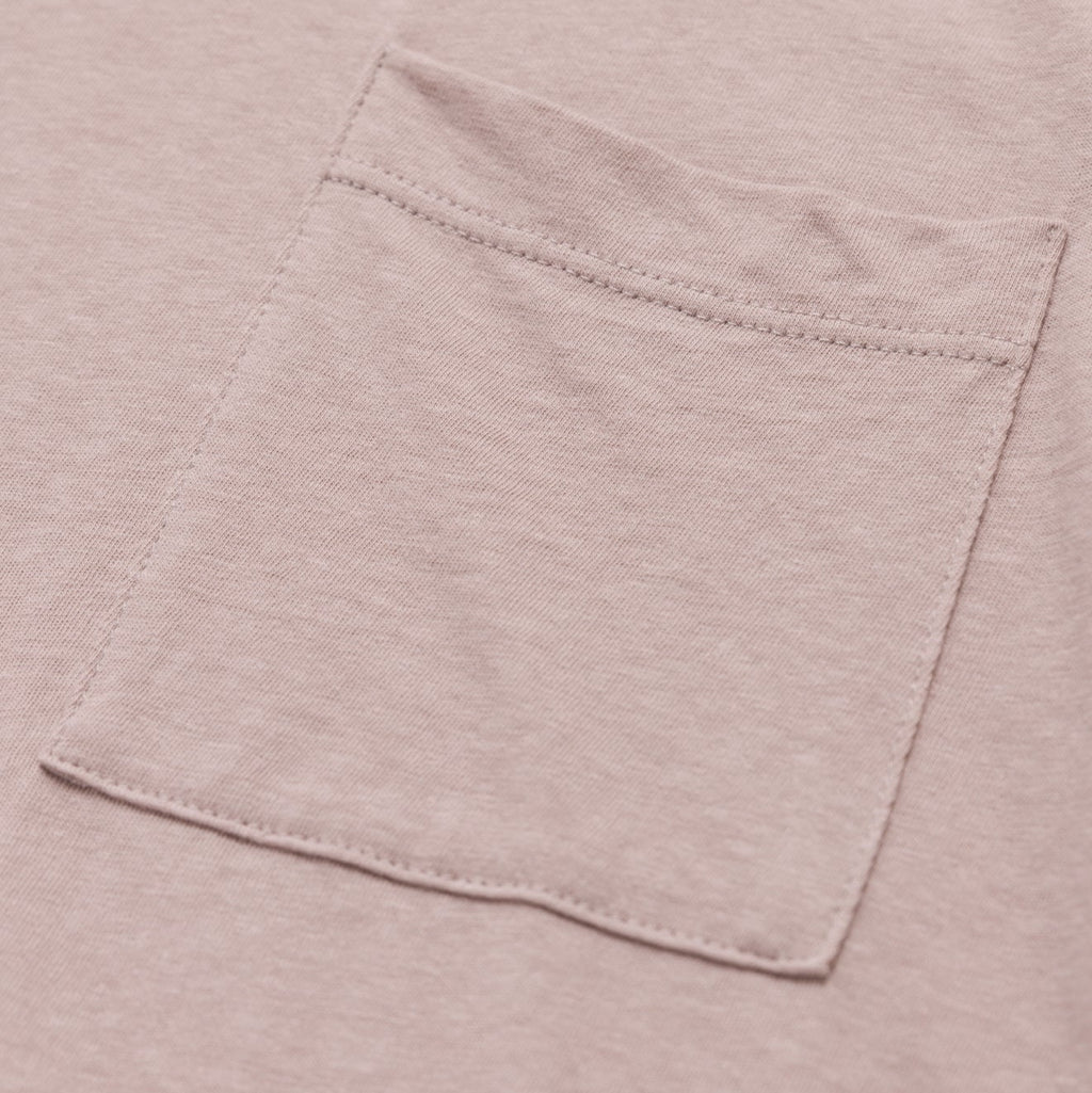 Close-up of a pocket on a light pink shirt